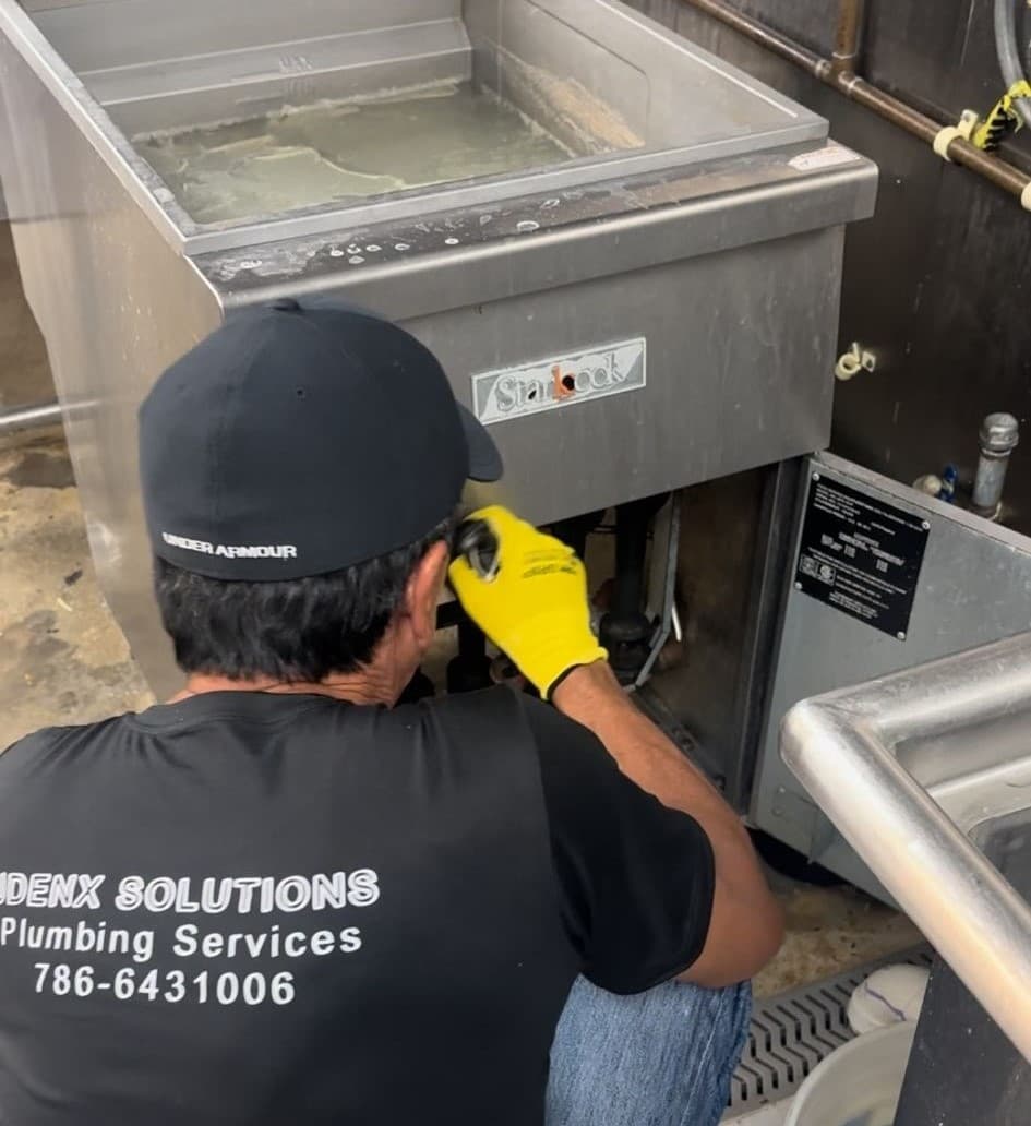 Plumber in South Miami working on a project